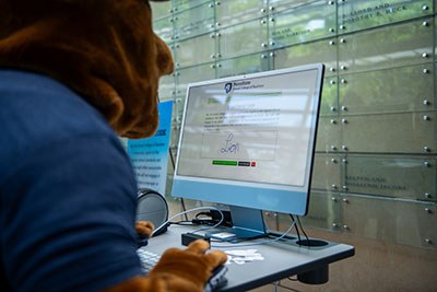 Nittany Lion Signing the Honor Code